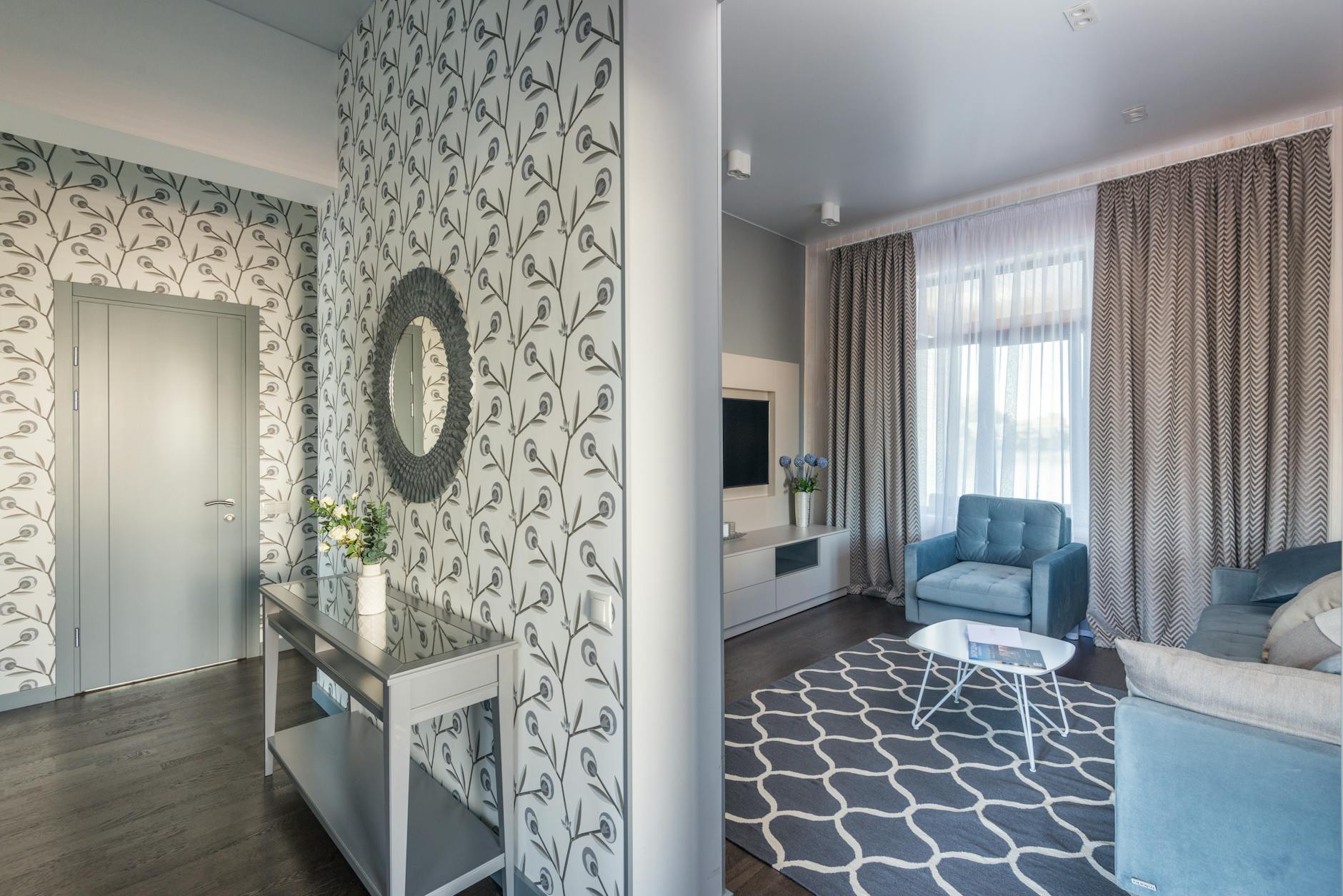 Gambar wallpaper dinding ruang tamu minimalis modern dengan desain sederhana dan warna netral yang memberikan kesan elegan dan nyaman.